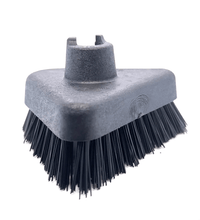 Triangular black cleaning brush head with sturdy bristles for deep cleaning surfaces using a steam machine.