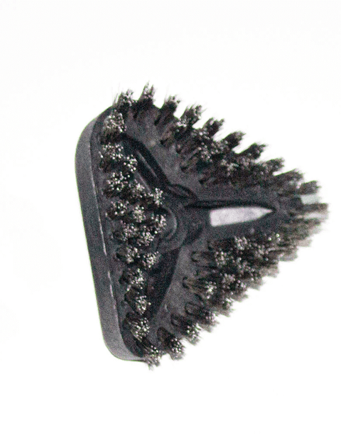 triangle metal brush used with a steam machine 